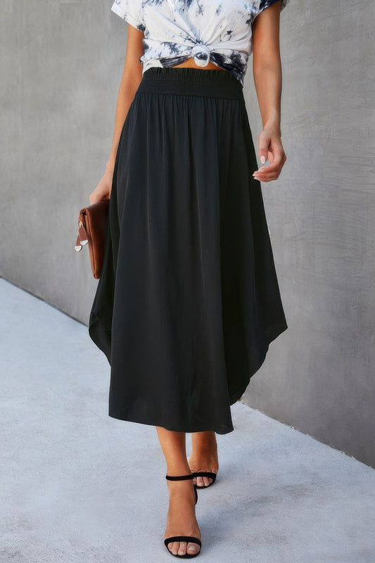 Solid Shirred Waist Asymmetrical Hem Flared Skirt - Goddess Vibes